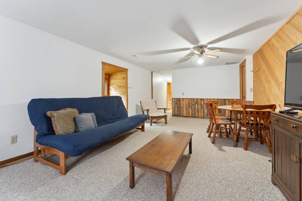 Upstairs lodge loft with queen futon, Roku TV, table & chairs, and extra space for relaxing. Upstairs lodge loft with queen futon, Roku TV, table & chairs, and extra space for relaxing. - Eagle Bluff Estate - Mauston