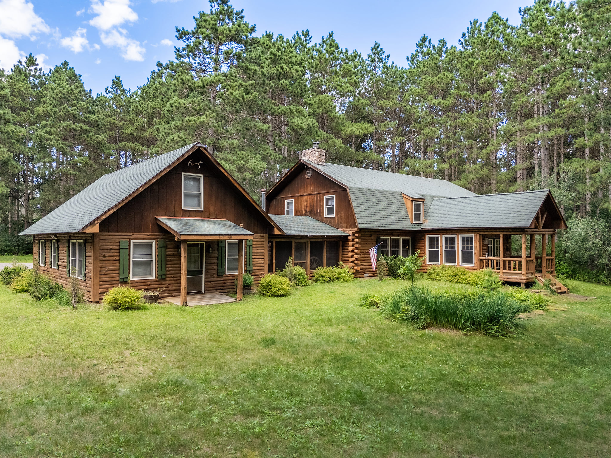 Eagle Bluff Estate includes a 4,500 sqft lodge & 1,200 sqft cabin with separate entrances, kitchens and living spaces. The entire Estate sleeps 25+ guests with tons of extra room. There are two screened-in porches, a balcony, fire pit, & much more