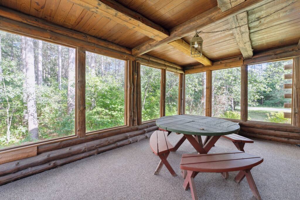 Screened-in porch with exterior access or interior access through one of the lodge main-level bedrooms. Great place to relax and watch mother nature while enjoying the great breeze. Screened-in porch with exterior access or interior access through one of the lodge main-level bedrooms. Great place to relax and watch mother nature while enjoying the great breeze. - Eagle Bluff Estate - Mauston