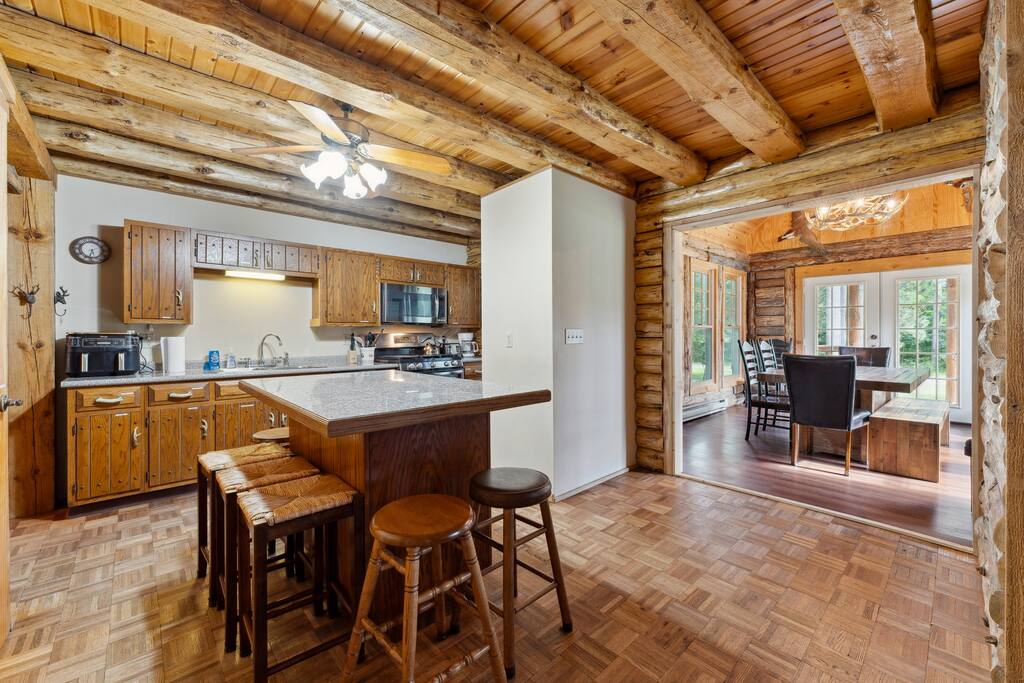 The lodge kitchen has bar stools for the island, air fryer, Keurig, dishwasher, stove, microwave, fridge, pots & pans, dinnerware, blender, tea & tea pot, Keurig (BYO K-Cups) and coffee pot (coffee supplied), small selection of spices and much more. The lodge kitchen has bar stools for the island, air fryer, Keurig, dishwasher, stove, microwave, fridge, pots & pans, dinnerware, blender, tea & tea pot, Keurig (BYO K-Cups) and coffee pot (coffee supplied), small selection of spices and much more. - Eagle Bluff Estate - Mauston