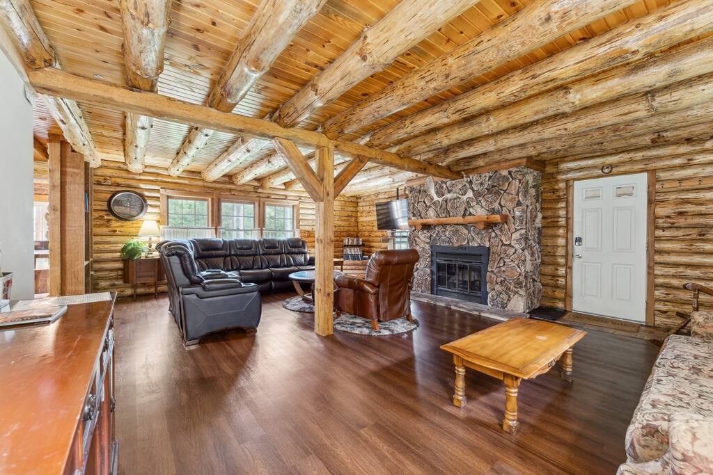 Living room of the lodge includes a leather sectional couch, Roku TV, wood burning fireplace, blu-ray plaer with tons of movies, additional recliner, and great decor. There is also a library with a variety of reading materials and new flooring. Living room of the lodge includes a leather sectional couch, Roku TV, wood burning fireplace, blu-ray plaer with tons of movies, additional recliner, and great decor. There is also a library with a variety of reading materials and new flooring. - Eagle Bluff Estate - Mauston