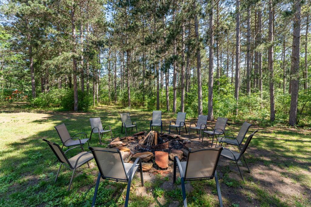 Secluded backyard with fire pit, picnic table with tons of seating, gas grill with propane supplied Secluded backyard with fire pit, picnic table with tons of seating, gas grill with propane supplied - Eagle Bluff Estate - Mauston