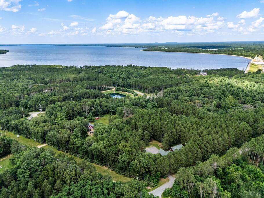 Drone photo with the amazing view of Eagle Bluff Estate. In the background is Castle Rock Lake, where that you can enjoy any water activity including boating, tubing, water skiing, swiming and more. It is a .5 mile walk or 1.7 mile drive to the beach Drone photo with the amazing view of Eagle Bluff Estate. In the background is Castle Rock Lake, where that you can enjoy any water activity including boating, tubing, water skiing, swiming and more. It is a .5 mile walk or 1.7 mile drive to the beach - Eagle Bluff Estate - Mauston
