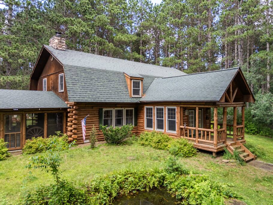 Lodge from the front yard view. To the left is the screened-in porch & pond, and to the right is the Four Seasons dining room. Lodge from the front yard view. To the left is the screened-in porch & pond, and to the right is the Four Seasons dining room. - Eagle Bluff Estate - Mauston