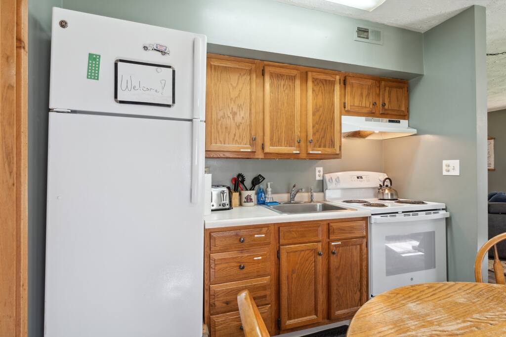 The cabin kitchen includes a Keurig (BYO K-Cups), coffee pot & coffee, stove, microwave, fridge, pots & pans, dinnerware, blender, tea & teapot, a small selection of spices, and much more. There is a poker table top in the main level bedroom. The cabin kitchen includes a Keurig (BYO K-Cups), coffee pot & coffee, stove, microwave, fridge, pots & pans, dinnerware, blender, tea & teapot, a small selection of spices, and much more. There is a poker table top in the main level bedroom. - Eagle Bluff Estate - Mauston