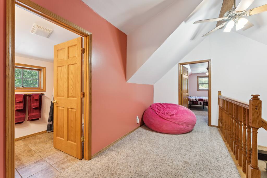Loft at the top of stairs featuring with bean bag chair, two bedrooms, and full bathroom. Loft at the top of stairs featuring with bean bag chair, two bedrooms, and full bathroom. - Bear Cove Escape - Lyndon Station
