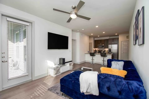 our stylish living room with plush sofa, pillows,and warm ambiance.This space is perfect for relaxation and socializing.Whether you want to curl up with a  book,watch your favorite show on the TV, our