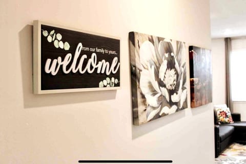 Step into your home away from home through our welcoming entryway, where the warm glow of soft lighting and tasteful decor sets the stage for a memorable stay.