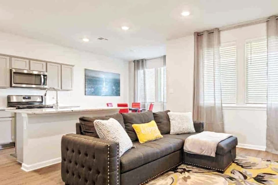 Enjoy the perfect blend of spaciousness and modern design in our inviting open concept living room, ideal for gathering, entertaining, and relaxation.
