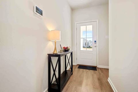 Step into your home away from home through our welcoming entryway, where the warm glow of soft lighting and tasteful decor sets the stage for a memorable stay.