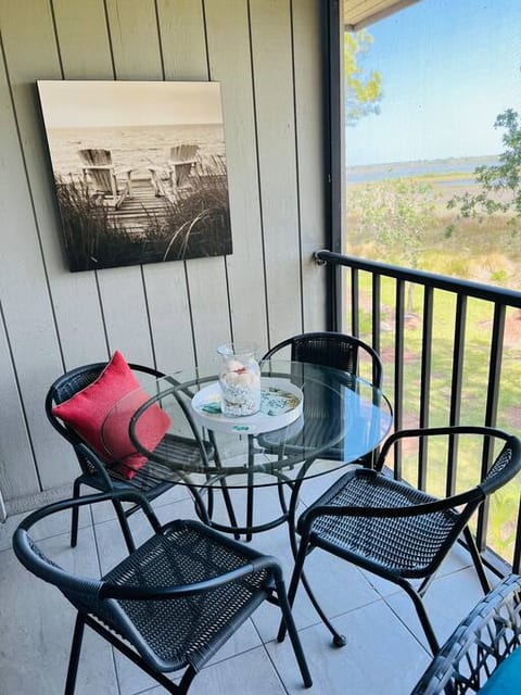 22-foot screened in lanai with cafe lights and brand new furniture