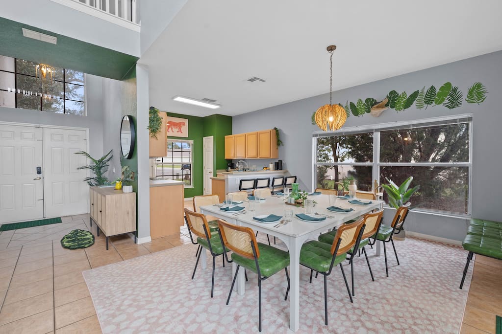 The dining area, conveniently nestled next to the front door entrance, invites you to share meals in a warm and welcoming space. - Luxury Retreat: Davenport 5bd | Games | Pool Bliss - Davenport