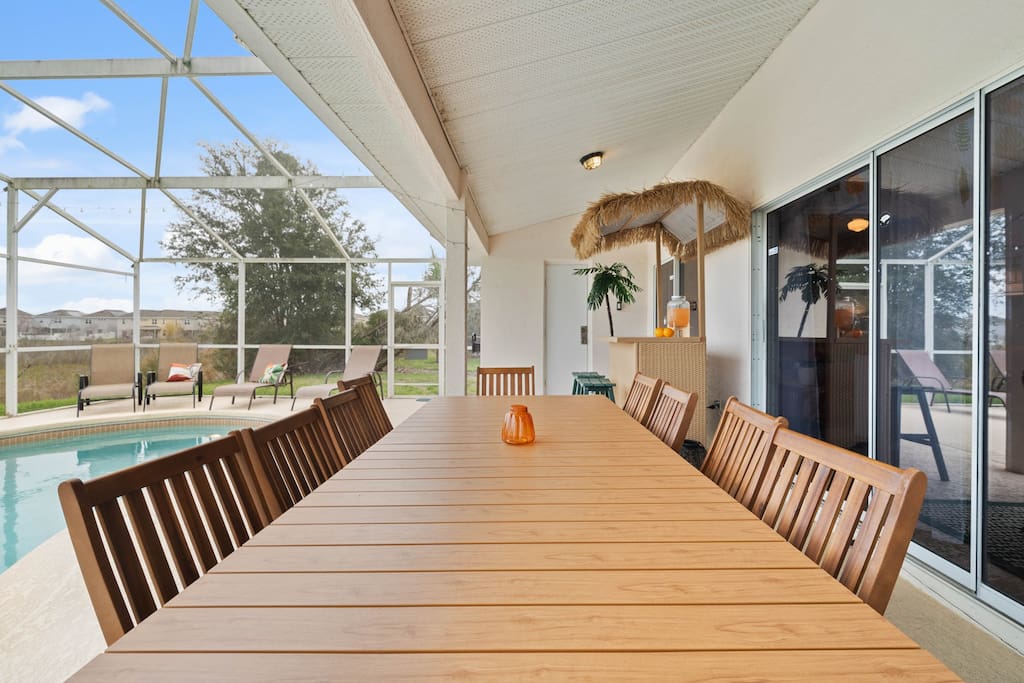 Immerse yourself in the perfect blend of relaxation and culinary indulgence at the outside dining area by the pool. - Luxury Retreat: Davenport 5bd | Games | Pool Bliss - Davenport