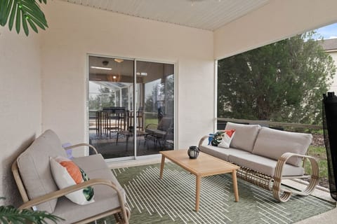 Seamless indoor-outdoor living: A covered patio oasis just steps away from indoor comfort. Enjoy the perfect blend of nature and coziness with convenient access to the indoors.