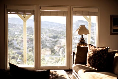 3 six foot windows showing western views from your huge down sectional couch.