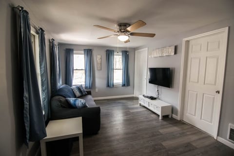 The TV has a retro gaming system and a DVD player for your entertainment.  The living room features a loveseat size couch.   The couch does have a pull out sleeper option but you will have to make the pull out bed yourself.