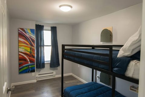 The second bedroom has bunk beds -- two twin mattresses. Each bed has its own storage along the wall for books, tablets, etc..