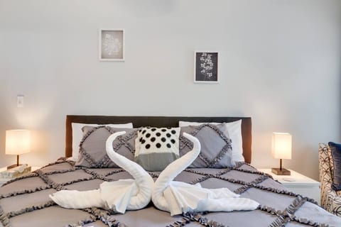 King size bed in primary bedroom with ensuite bathroom