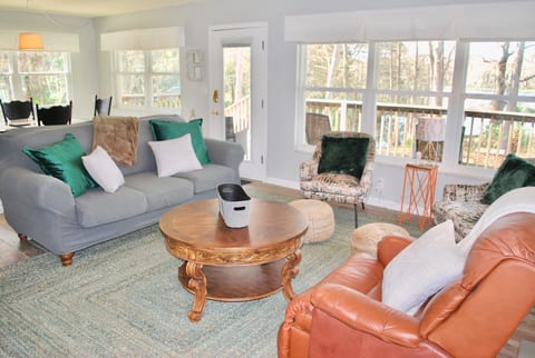Living room with view of river.
Smart TV mounted on wall