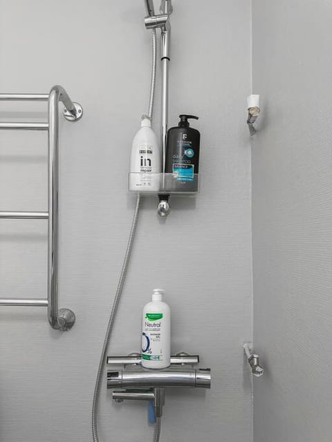 High quality shampoo, hair conditioner and shower gel are always found in the shower area. The shower area does not have a shower curtain, so we recommend removing the toilet paper from its holder while taking a shower, so it doesn't get wet.