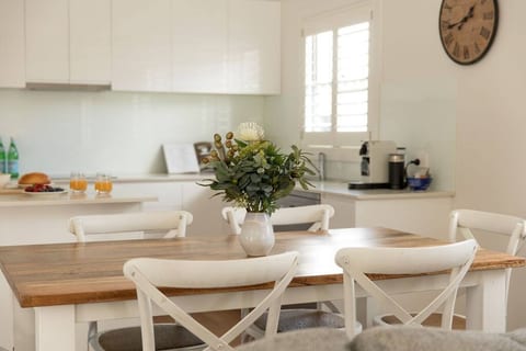 Kitchen with Stone benchtops, Smeg appliances, Netpresso Coffee Machine, Smeg dishwasher, Microwave, Smeg Dishwasher, Stone servery bench