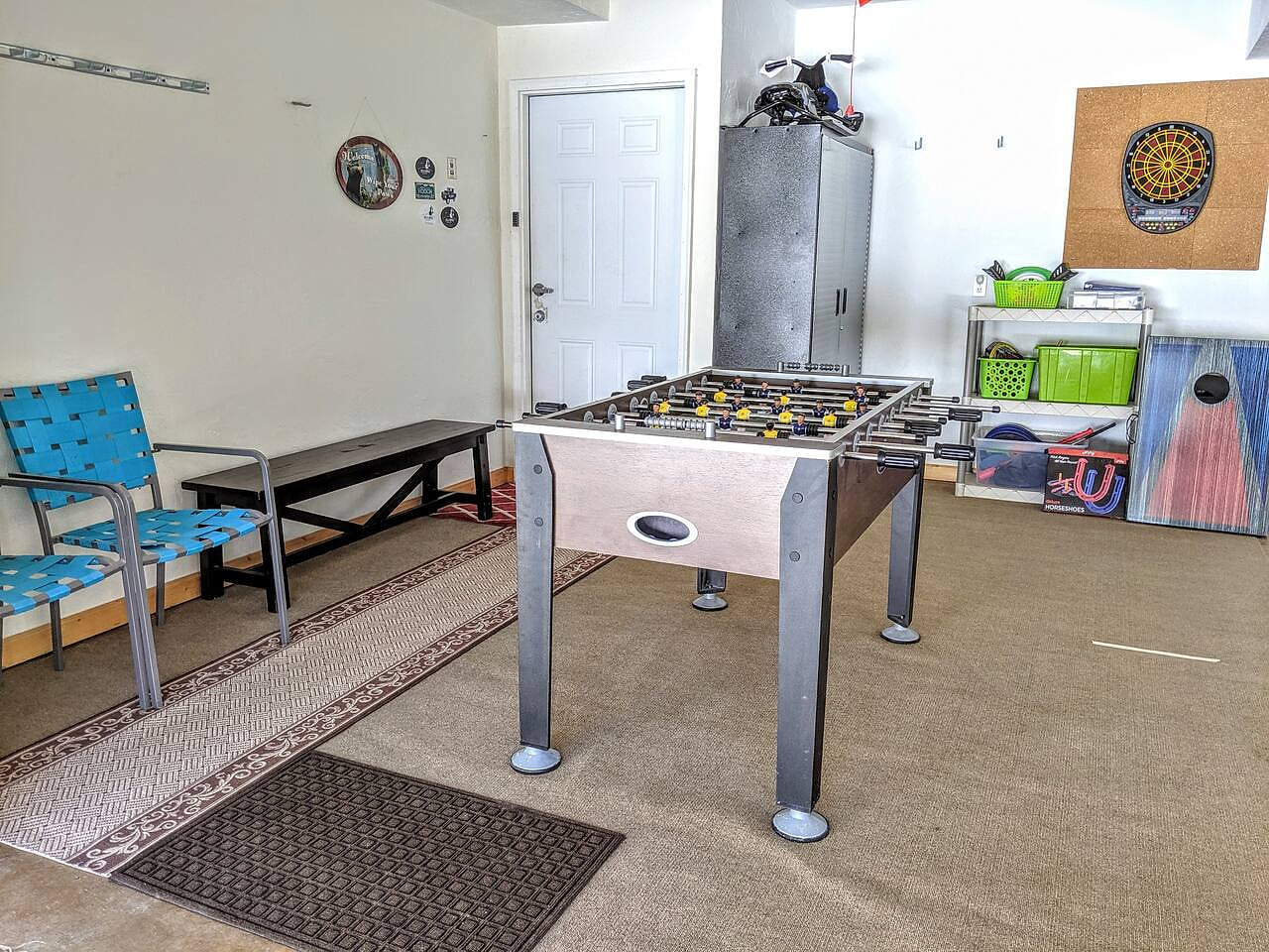 In the summer, have fun playing Foosball or darts in the garage game room. Head outside, and challenge each other in a game of corn hole, horse shoes or other outdoor games provided.
