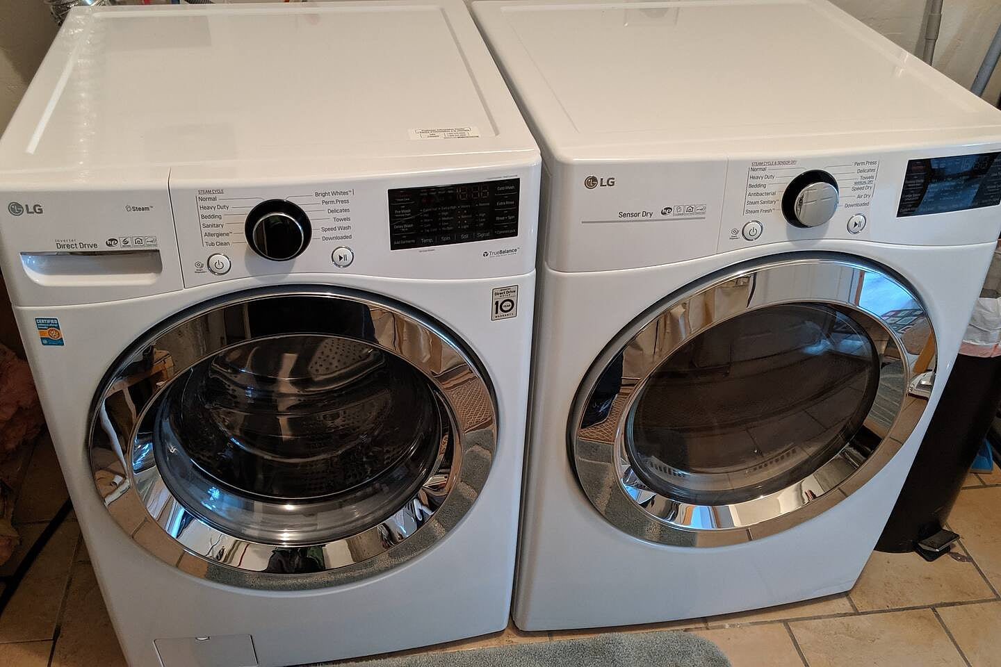 LG washer and dryer with laundry detergent for your use.