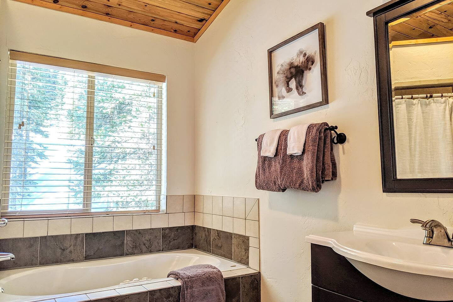 Imagine soaking the days activities away in the soaking tub, with the wooded views.