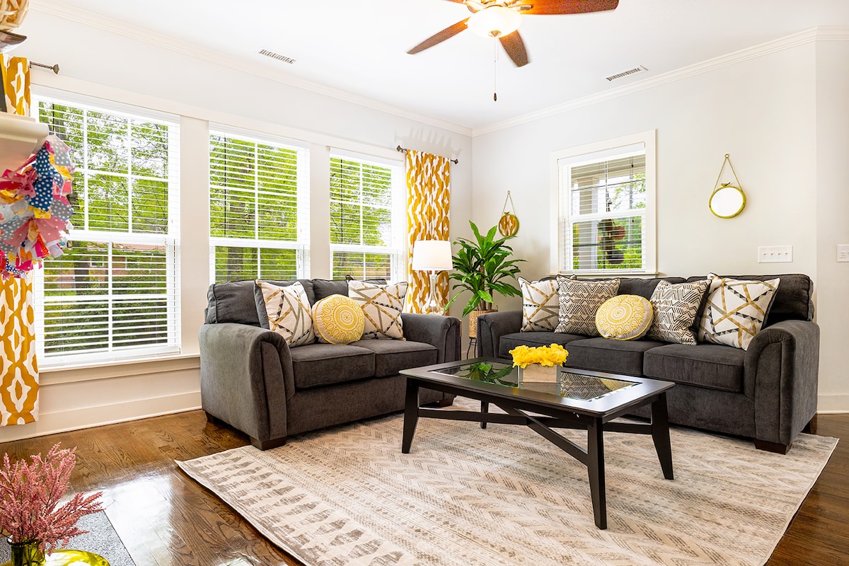 Open floor plan with couch and love seat in the living room
