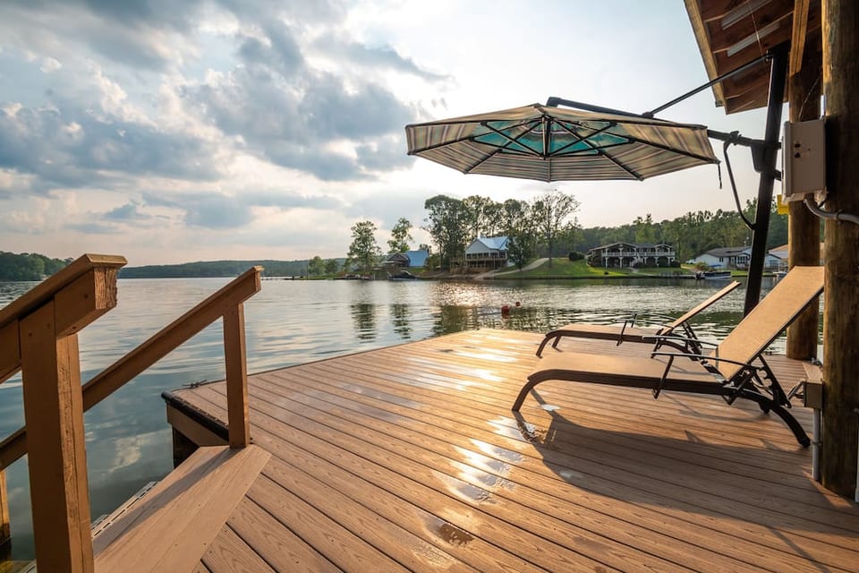 Dockside lounge overlooking private swimming area with stair access.