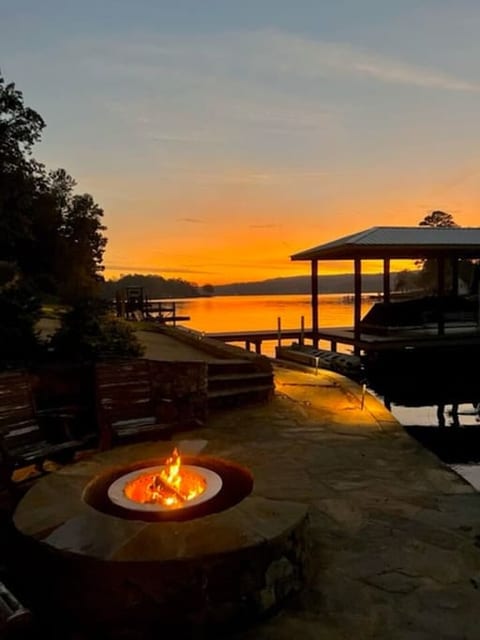 Waterfront firepit view at sunset.