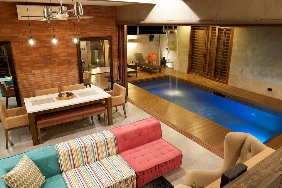 A uniquely designed villa allowing you to dine by the pool, relax in the living room by the pool or chill in the lounge chairs facing the pool with ultimate privacy. A mixture of industrial and modern design elements.