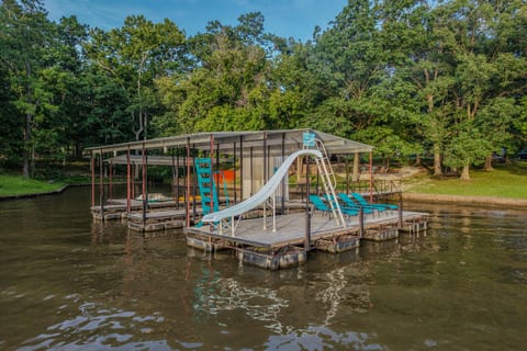 The dock is all yours with two 10x24 boat slips and a swim platform with water slide and wet steps!