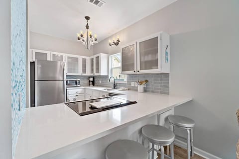 Open updated kitchen with bar seating
