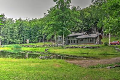 secluded-open-air-cabin-spring-fed-swimming-pond/