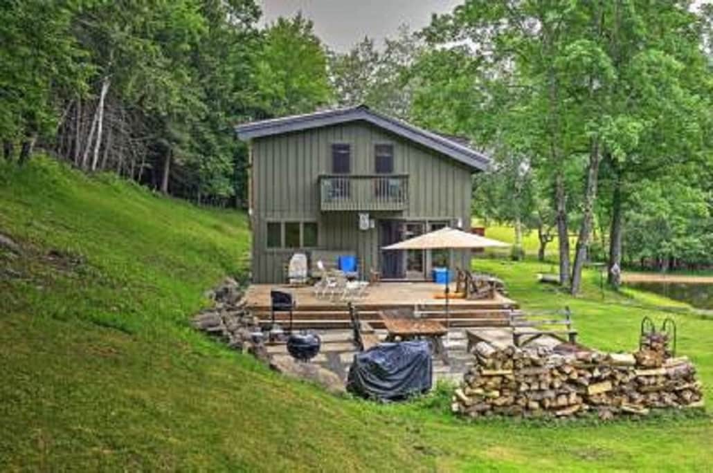secluded-open-air-cabin-spring-fed-swimming-pond/