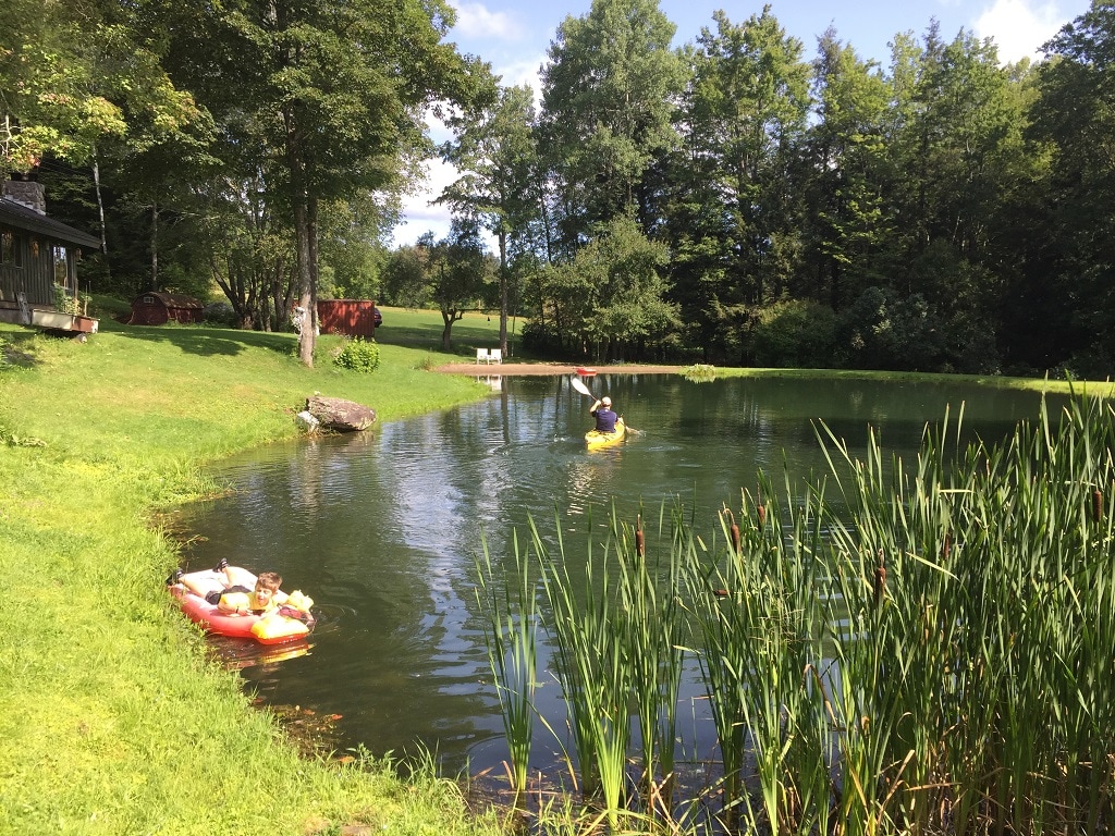 secluded-open-air-cabin-spring-fed-swimming-pond/