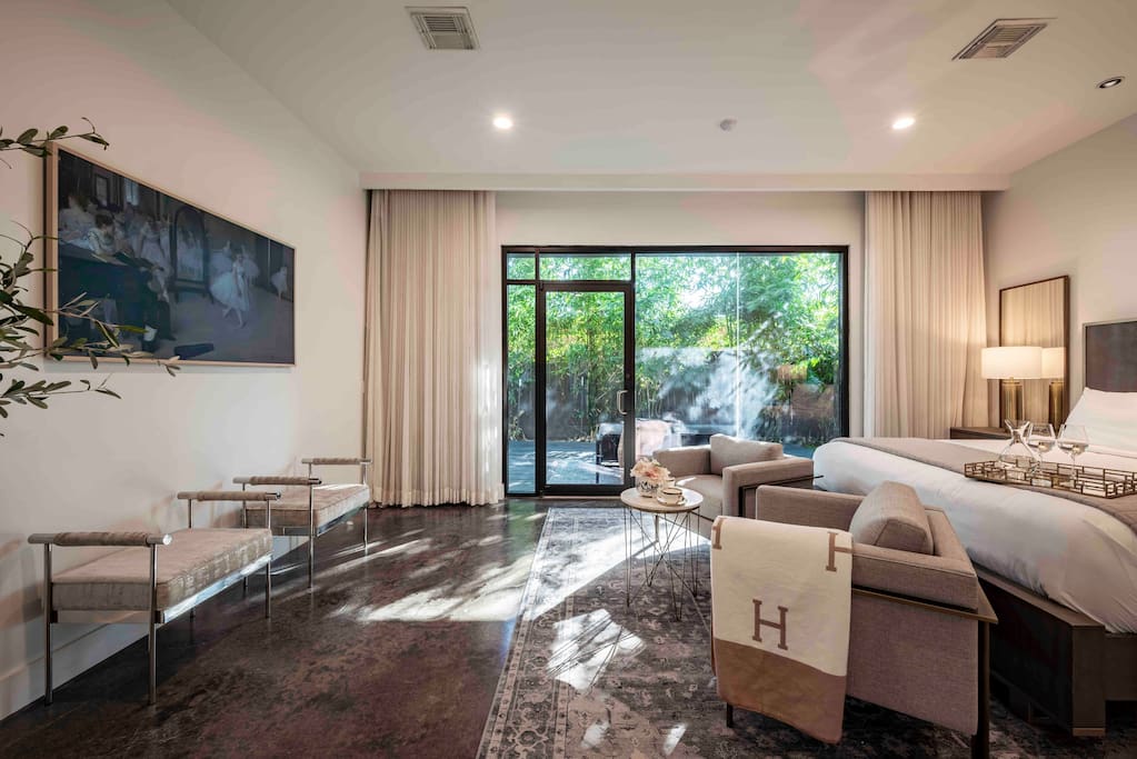 1st Floor: Primary bedroom suite with en-suite spa bathroom and private outdoor terrace for lounging, features 65” Art tv.
First floor access is convenient for recovering patients.