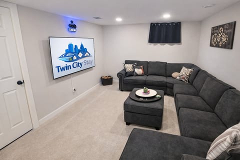 TV room downstairs.  65" TV and a large sectional couch for the gang.  Watch the game or your favorite show.