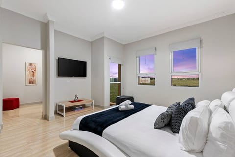 Spacious Master Bedroom with King Bed, Walk In Wardrobe Room, and an Ensuite