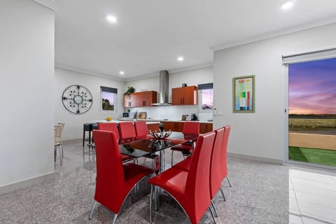Open Plan Dining and Kitchen Areas with access to backyard