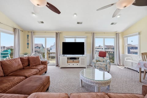 Large TV with plenty of seating.