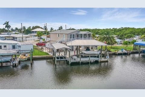 This 2br/2ba Elevated Home with Two Boat Lifts