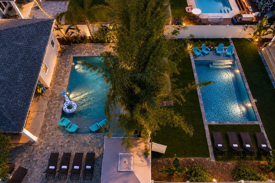 Aerial view of Beach Estate compound with two private heated pools and adjoining backyards