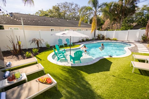 Private heated pool with sun shelf, in-water seating, and plenty of space to soak up the Florida sunshine.