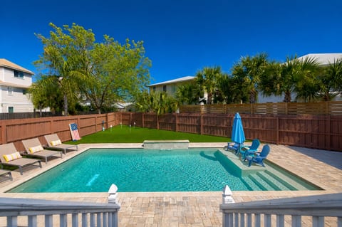 Surrounded by palms and privacy, this backyard is designed for slow mornings, sunny afternoons, and effortless outdoor living.