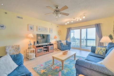 Spacious living area with ocean views and 50 inch Roku smart TV.
