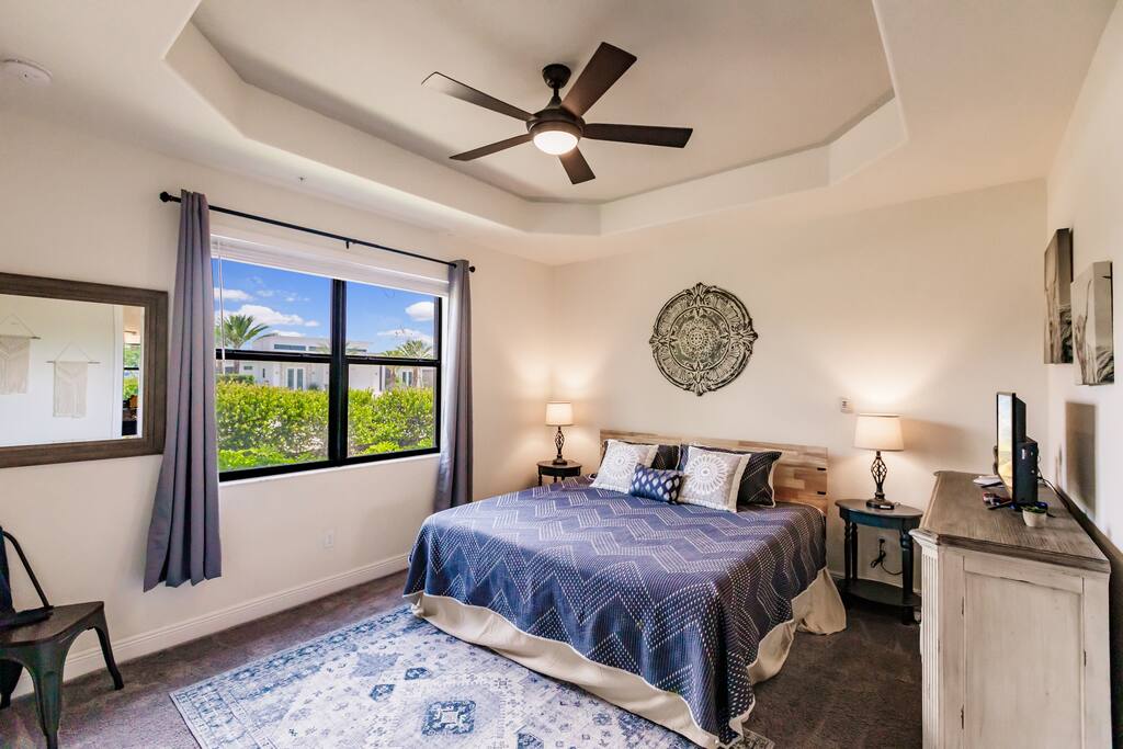 Luxury Condo:  Master Bedroom Suite with King Size Bed
Includes smart television, dresser, desk, and closet.  Access to the Master Bath from the Master Bedroom.  Note floors in this room have been replaced with tile.
