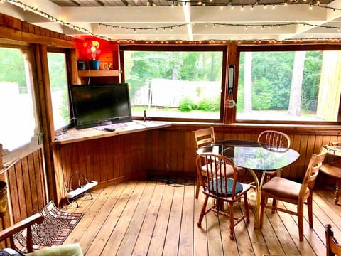Spacious screened in porch that includes mini fridge, microwave, work station for serving and grilling.