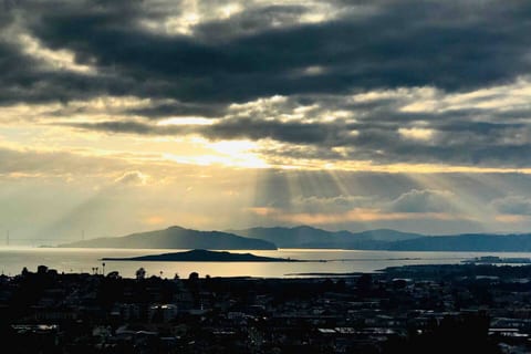 Golden Gate Bridge and San Francisco Bay at sunset from the hill just behind the cottage ( 2 min hike ); taken by our Airbnb Guest / movie director Bogdan Darev